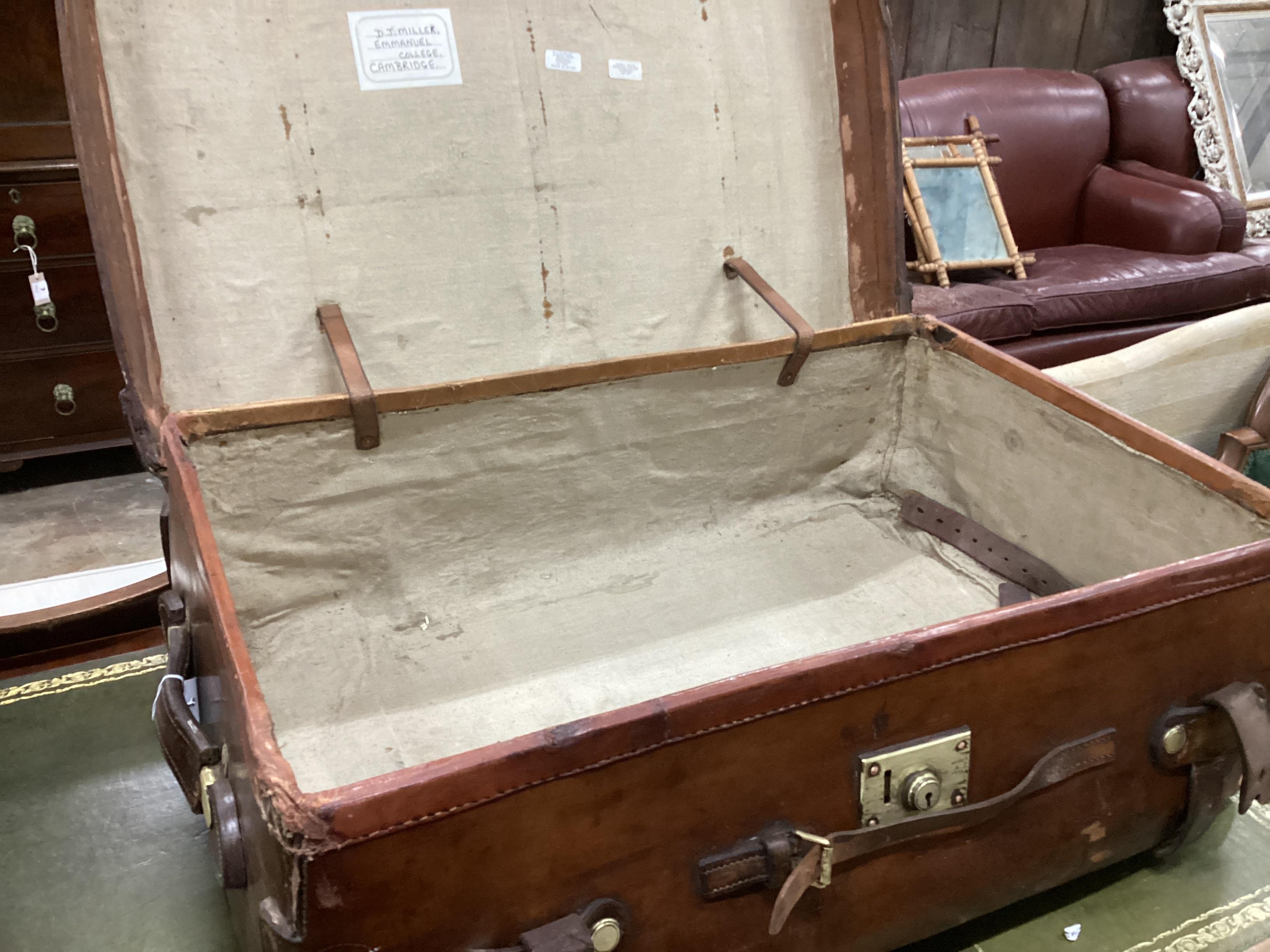 A Victorian leather brass and copper studded travelling trunk, width 86cm, depth 55cm, height 30cm